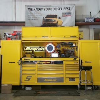 This bold yellow 124&apos; Snap-on tool set up features a Snap-on Classic Series main box, two side lockers and a hutch.