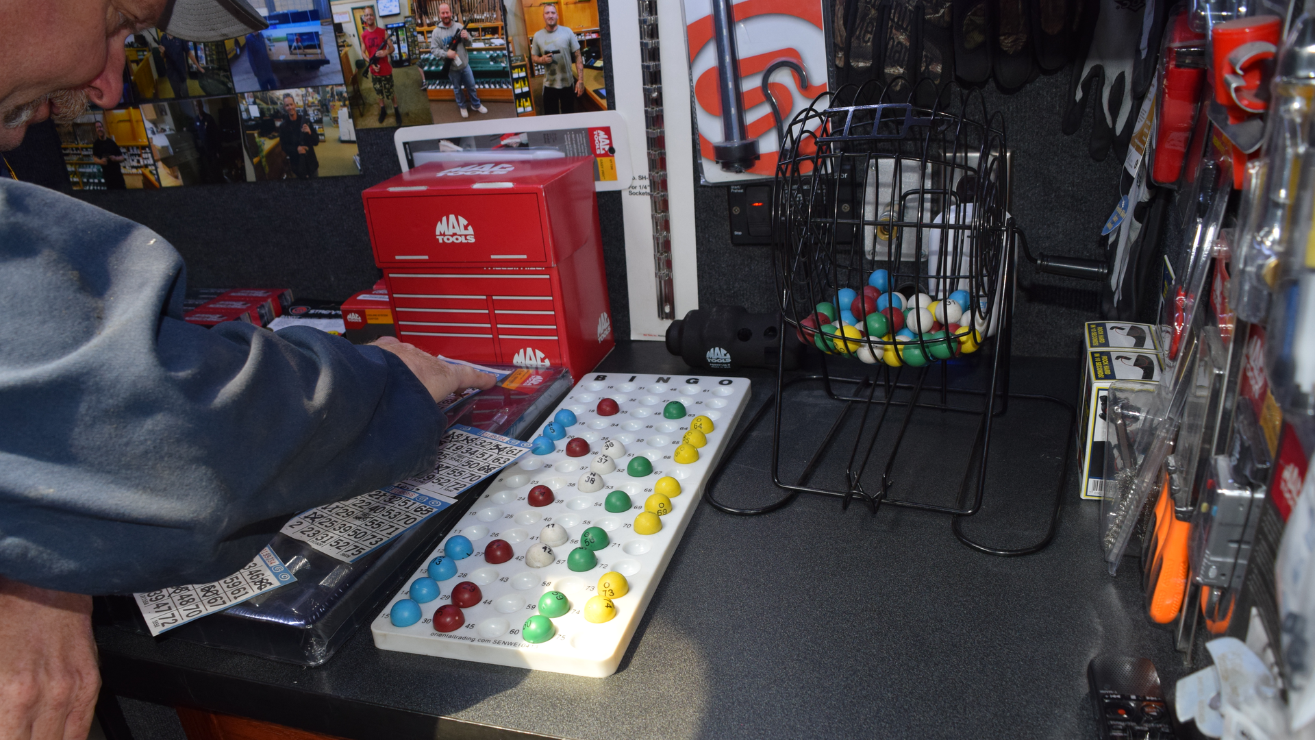 A customer checks the status of his Bingo cards during the current raffle Whittington hosts.