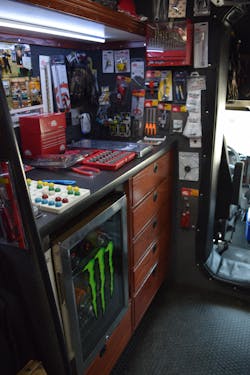 This corner of Whittington’s truck showcases previous raffle winners, as well as a current BINGO raffle. He also opted to have a refrigerator installed on the truck, to house cold drinks for customers. This corner of Whittington’s truck showcases previous raffle winners, as well as a current BINGO raffle. He also opted to have a refrigerator installed on the truck, to house cold drinks for customers.