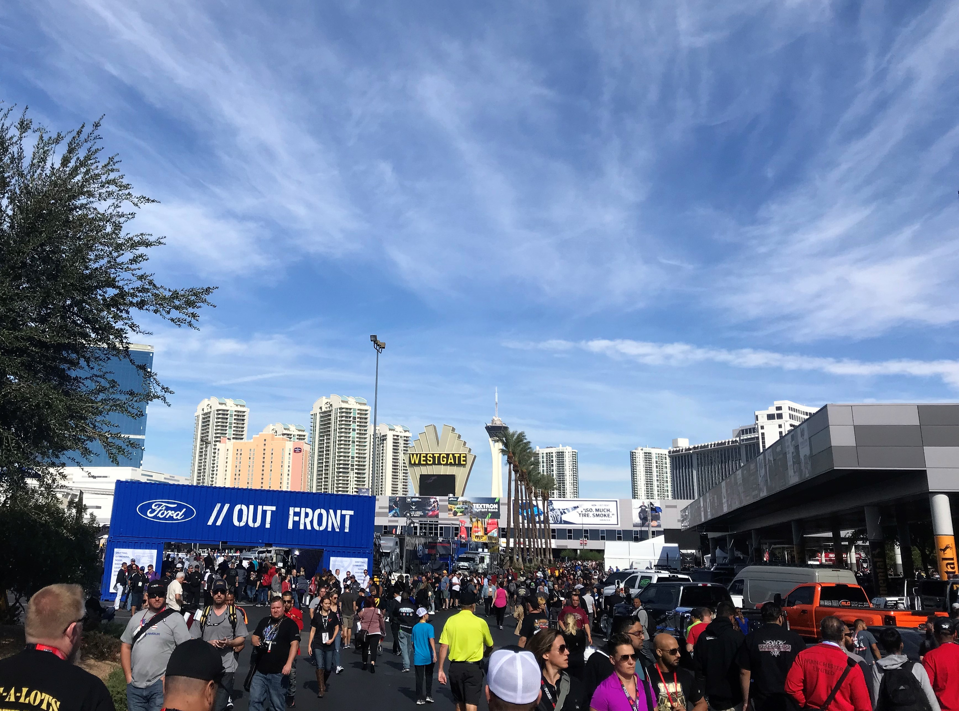 Outside of the large conventions centers, there are outdoor company booths, a drive track and many custom cars and trucks.