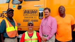 With Phil Byrd, president of Bulldog Hiway Express, (second from right), are senior drivers,(left to right), Robert Gibbs, Timothy Smith and Gerald Waring With Phil Byrd, president of Bulldog Hiway Express, (second from right), are senior drivers,(left to right), Robert Gibbs, Timothy Smith and Gerald Waring