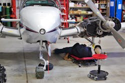 Like automotive technicians, aircraft technicians utilize adjustable creepers and stools on the job. Pictured here: A Wisconsin Aviation technician on the Whiteside MTL2UP 40&apos; Either End Adjustable Creeper