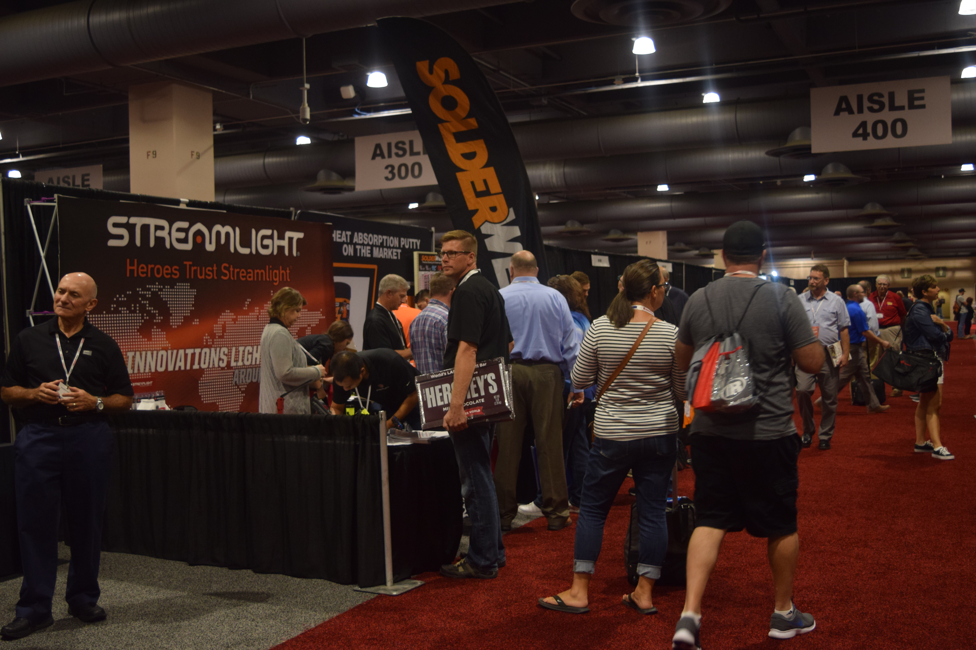 Attendees visit the Streamlight booth during the Medco 2018 Customer Show.