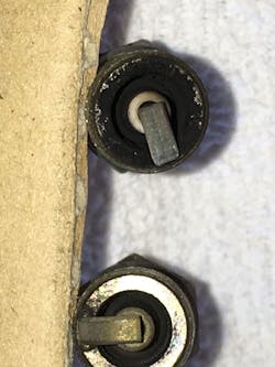 FIG4- Note, the carbon build-up on the spark plug removed from bank 2 is different from the bank 2 plug.
