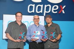 Left to right, representing the Best of Show winners in the AAPEX 2018 Best Booth Awards are Doug Spitler, president, Ullman Devices; Flloyd Sobczak, marketing manager, Gates Corporation; and Mike Barthel, marketing manager, Ullman Devices.