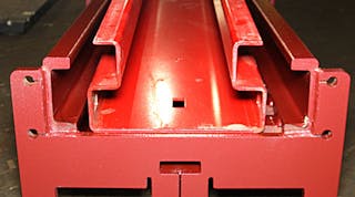 Higher quality lifts typically use heavy welded steel channels (lower) whereas less expensive lifts are made of lighter sheet metal (upper).