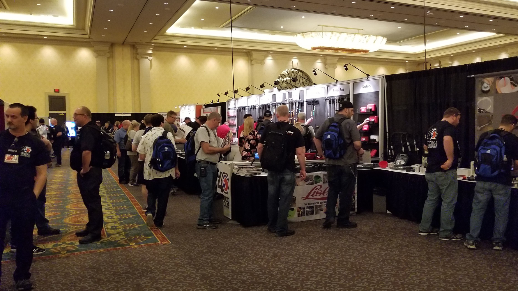 Attendees browse supplier booths on the show floor at the Matco Tools Expo.