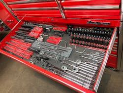 The toolbox features 23 drawers organized neatly by category.