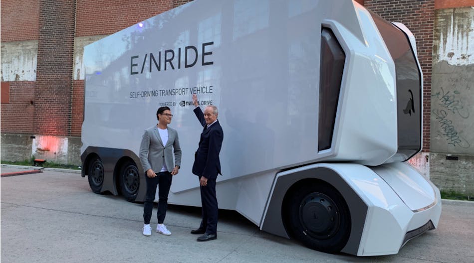 Michelin Group&rsquo;s CEO Florent Menegaux with Einride&rsquo;s Head of Operations, Niklas Reinedahl, in front of the T-pod during the Movin&rsquo;On Summit 2019 in Montreal.