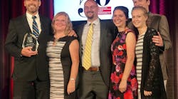 LSI President and Founder Chris Gabrelcik accepts the Smart 50 Award for Innovation, sponsored by Smart Business Magazine, with members of his family.