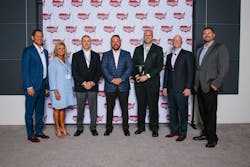 Wabco team members accept the 2019 Pinnacle Award from Wabash National senior leaders. Pictured are (left to right) Richard Mansilla, director of global strategic sourcing, Wabash National; Allison Belden, customer service manager, Wabco; Patrick Kealy, trailer business leader, Wabco North America; Brent Yeagy, president and CEO, Wabash National; Zakary Kennedy, key account leader, Wabco; Nick Adler, vice president of supply chain and business transformation, Wabash National; and Cody Vaught, global category manager, Wabash National.