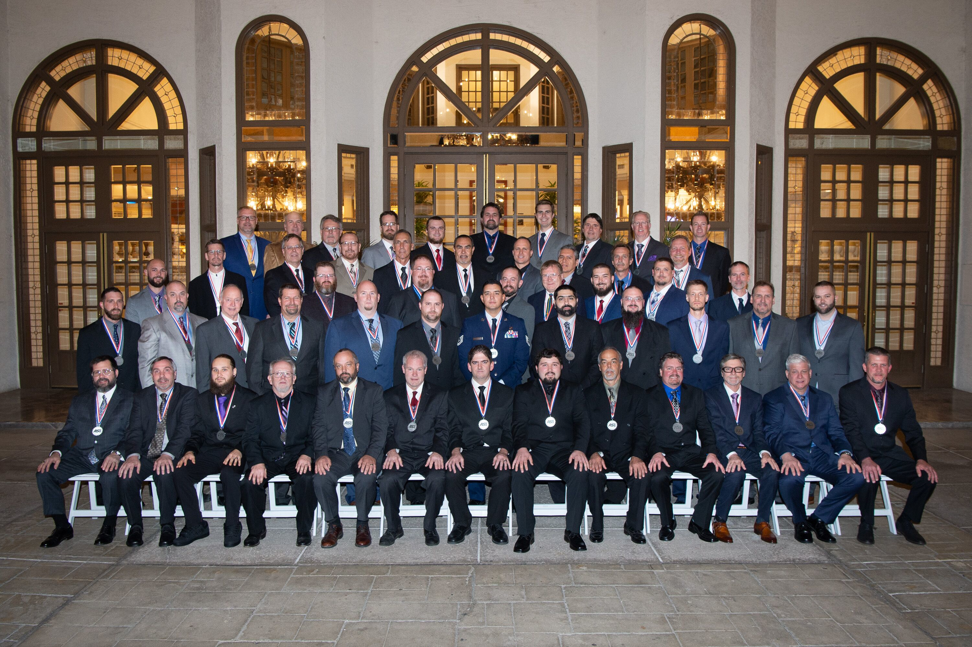 2019 Award Winner Group Photo: Front row (L to R): Frank Kloiber, Walt Rundell, Tyler Moquin, Jerry Campbell, Michael Flud, Dave Massey, Jason Jackson, Zach Ward, Steve Baker, Brad Cadwell, Tim Stone, Eddie Creel, Dwayne Dodson. 2nd Row (L to R): Scott Murphy, Darin Stalker, Jerry Holcom, Scott Detwiler, Norm Kranz, Bill Hurrelbrink, TSgt Ezra Goldtooth, Chuck Haddad, Jeff Fullen, Brandon Pinette, TJ Anderson, Jake Sorenson. 3rd Row (L to R): Chris Jost, Adam Erickson, Jerid Friese, Jeff Wachter, Bill Dallas, Chris Doyle, Tim Creech, Steve Eastman. 4th Row (L to R): Chris Corzatte, Craig Raider, Dave Newman, Cameron Campbell, Raul Villalobos, Jeremy Pennington, Andres Solis, David Alspaugh, Greg Weigart. Top Row (L to R): Jon Kisby, Marvin Rogers, David Knox, Matt Klebeck, Grayson Wilkes, Kevin Fisher, Tom Witbeck, John Peschke, Jim Raub, Dale Henry. Not pictured: Doug Bernitt.