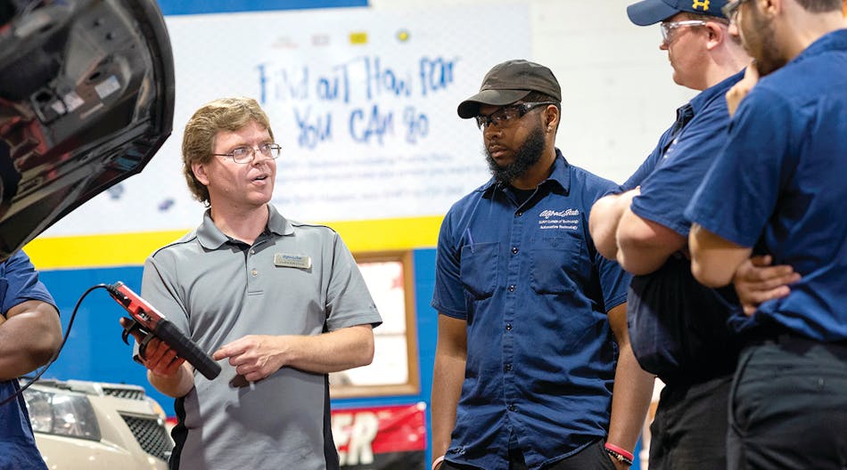 Alfred State College of Technology Instructor Jason Kellogg works with students in a recently rebranded &lsquo;Race to 2026&rsquo; technical training facility at the school.