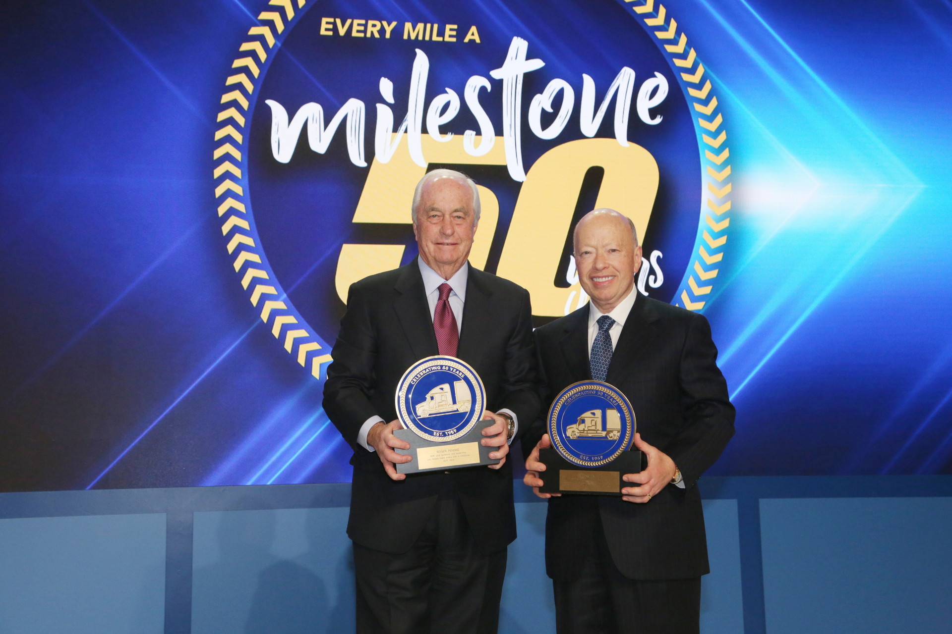 Roger S. Penske, left, chairman of Penske Transportation Solutions, and Brian Hard, president and CEO of Penske Transportation Solutions, pose for a 50th anniversary photo.