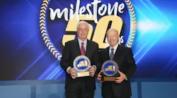Roger S. Penske, left, chairman of Penske Transportation Solutions, and Brian Hard, president and CEO of Penske Transportation Solutions, pose for a 50th anniversary photo.