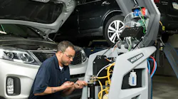 A technician works with MAHLE's ACX2250 service unit.
