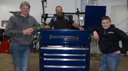 Eric Henricks (center) and the next generation of Henricks' Auto Service, Cameron (left) and Connor (right).