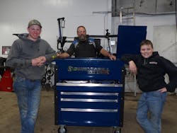 Eric Henricks (center) and the next generation of Henricks' Auto Service, Cameron (left) and Connor (right). Eric Henricks (center) and the next generation of Henricks' Auto Service, Cameron (left) and Connor (right).