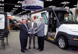 Morgan Olson&apos;s Rich Tremmel, vice president of sales and marketing, and Mark Hope, vice president of engineering, receive The Work Truck Show 2020 Innovation Award, body concept category, for the company&apos;s Class 2 Storm step van, from NTEA President and CEO Steve Carey.