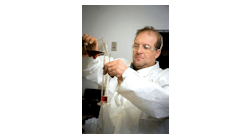 Kevin Adams, vice president of research and development, LSI Chemical, tests a new LSI Chemical oil additive. Kevin Adams, vice president of research and development, LSI Chemical, tests a new LSI Chemical oil additive.