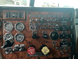 Image of a Peterbilt 378 dash. Imagine all of the wiring required to operate the many switches and gauges on this vehicle.
