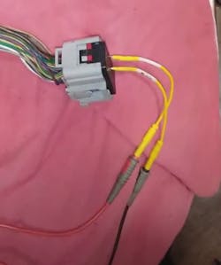 Figure 6 - After isolating the engine wire harness from the PCM, the audible output function of the DVOM (used for a continuity-check), indicated two fuel injector control circuits shorted together. Proving the fault was not internal to the PCM but within the engine wire harness, itself. Figure 6 - After isolating the engine wire harness from the PCM, the audible output function of the DVOM (used for a continuity-check), indicated two fuel injector control circuits shorted together. Proving the fault was not internal to the PCM but within the engine wire harness, itself.