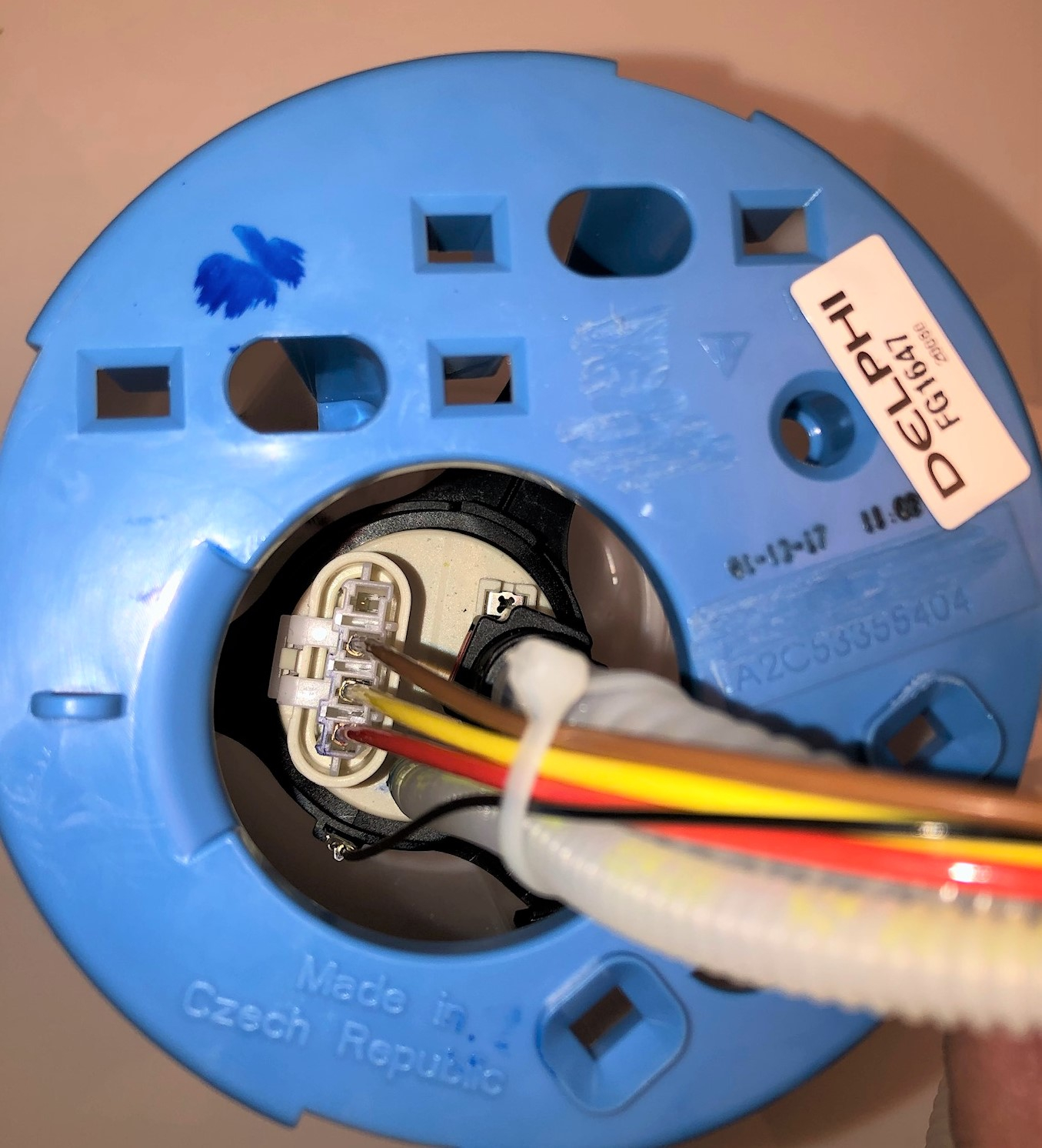 In addition to the vehicle schematics indicating you&rsquo;re working on a three-phase BLDC fuel pump, the actual wires leading to the fuel pump motor are equally helpful in establishing what you are encountering. Note the red, yellow and brown wires. A much smaller gage black wire (RFI shield) terminates on a metal clip fastened to the side of the fuel pump motor&rsquo;s body. NEVER try 'jumping' power and ground across any of the three-phases in your testing. The motor will be damaged! These motors require a three-phase BLDC FPCM to pulse each phase (every 120 degrees at a high frequency) to work.