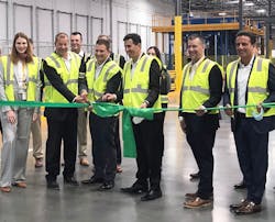 Members of the MANN+HUMMEL team, with representatives from DHL present, cut a green ribbon to signify the opening of the new West Coast Distribution Center. MANN+HUMMEL team members in yellow safety jackets include (left to right): Isabell Kloess, Stefan Tolle, Kurk Wilks, Rodrigo Reyes, Karl Westrick and Sergio Bellacicco. Members of the MANN+HUMMEL team, with representatives from DHL present, cut a green ribbon to signify the opening of the new West Coast Distribution Center. MANN+HUMMEL team members in yellow safety jackets include (left to right): Isabell Kloess, Stefan Tolle, Kurk Wilks, Rodrigo Reyes, Karl Westrick and Sergio Bellacicco.