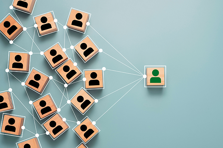 Conceptual block image of connecting one person to many