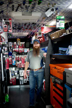 Cornwell tool dealer Johnathan Borth standing inside his tool truck
