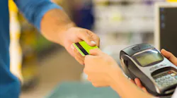 Man pays with credit card in this close-up shot