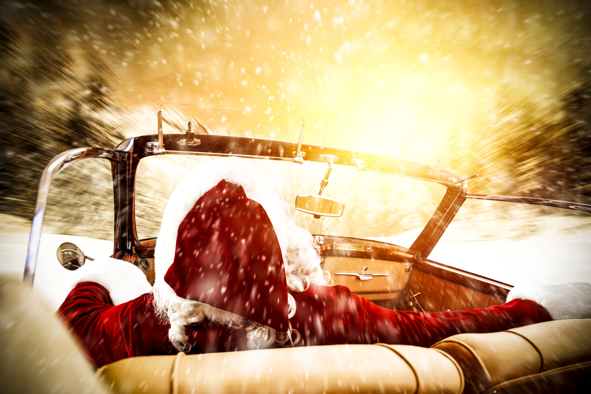 Santa driving a car into the sun