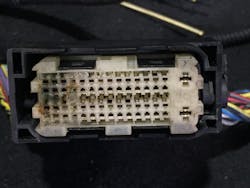 A connector to the engine control unit that has damage to the terminals.