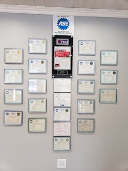 Muir proudly displays all his employees&apos; and his own ASE certifications, along with his previous PTEN Big-Time Box article.