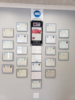 Muir proudly displays all his employees' and his own ASE certifications, along with his previous PTEN Big-Time Box article. Muir proudly displays all his employees' and his own ASE certifications, along with his previous PTEN Big-Time Box article.