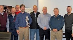 (L-R) Bobby Lord, director; Brian Dean, VP purchasing; Crow Lord, VP of sales; Tom Singleton, VP of store operations; Fletcher Lord, president (holding award); Kameron Spencer, VP of warehouse operations; Kenny Payne, VP of marketing; Fletcher Lord Jr., chairman of the board; Ben Butler, COO; Bill Schlatterer, CEO