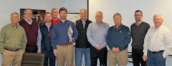 (L-R) Bobby Lord, director; Brian Dean, VP purchasing; Crow Lord, VP of sales; Tom Singleton, VP of store operations; Fletcher Lord, president (holding award); Kameron Spencer, VP of warehouse operations; Kenny Payne, VP of marketing; Fletcher Lord Jr., chairman of the board; Ben Butler, COO; Bill Schlatterer, CEO