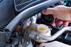 Brake fluid under hood of a car Brake fluid under hood of a car