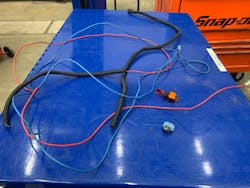 Figure 3- This photo shows the entire circuit, originating from the toggle switch, which was eliminated so focus could be placed on repairing the vehicle's A/C system correctly. Figure 3- This photo shows the entire circuit, originating from the toggle switch, which was eliminated so focus could be placed on repairing the vehicle's A/C system correctly.