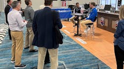 Seated at the table, Sunil Patel (left), with Tekmetric, and Parker Swift (right), with Mechanic Advisor, discuss business solutions at the Supplier and Training Expo (STX) with Bob Cushing, executive vice president of Advance Professional and president of Worldpac, with media and marketing representatives in attendance. Seated at the table, Sunil Patel (left), with Tekmetric, and Parker Swift (right), with Mechanic Advisor, discuss business solutions at the Supplier and Training Expo (STX) with Bob Cushing, executive vice president of Advance Professional and president of Worldpac, with media and marketing representatives in attendance.