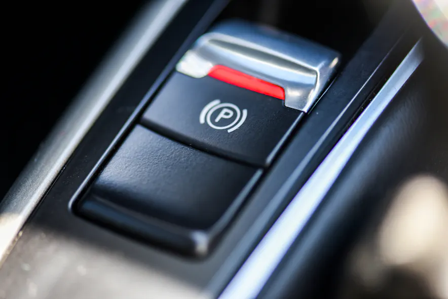 FIG1- The Electronic Parking Brake system is activated using an electronic switched input. this input is typically located on the center console.