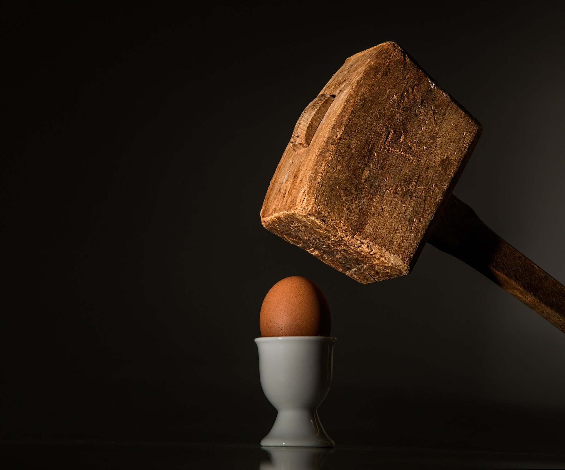 hammer hitting egg