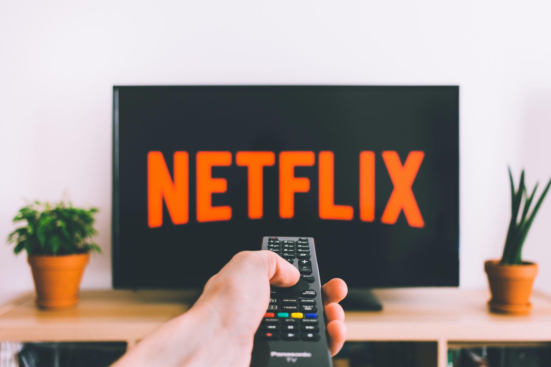 Netflix logo on TV screen with remote