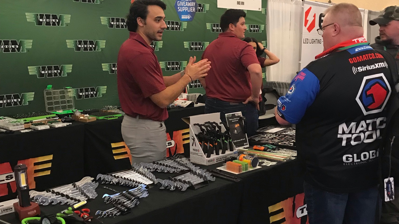 Tool distributors visiting VIM Tools booth at the Matco Tools Expo