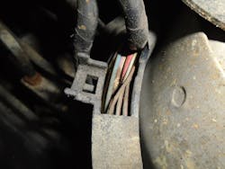 Figure 8- Notice the corrosion on the wire caused by battery acid from a corroded battery terminal. Also, notice the splatter of corrosion on the surrounding area. Figure 8- Notice the corrosion on the wire caused by battery acid from a corroded battery terminal. Also, notice the splatter of corrosion on the surrounding area.