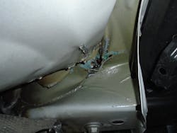 Figure 7- Damage under the right rear of a Lincoln SUV causing the liftgate to be out of alignment. Figure 7- Damage under the right rear of a Lincoln SUV causing the liftgate to be out of alignment.