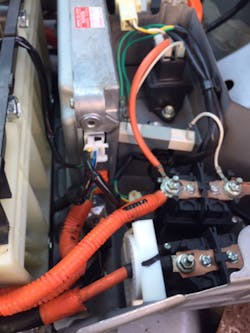 High voltage battery control module and current clamp (white component) on negative wire. High voltage battery control module and current clamp (white component) on negative wire.