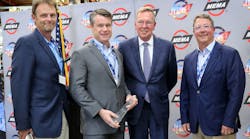 Honoring Sen. Todd Young (second from l.) with the Joseph M. Magliochetti Industry Champion Award are, from l., Bob Courtney, Mayor of Madison, Ind.; Bill Long, president and CEO of MEMA; and Dominic Grote, president and CEO of Grote Industries.