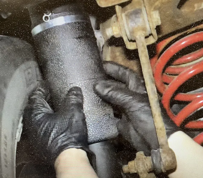 Figure 1- Inspect air bag condition. Brittleness, cracks and/or road debris damage can result in leaks, which cause the compressor to overwork and overheat.