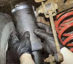 Figure 1- Inspect air bag condition. Brittleness, cracks and/or road debris damage can result in leaks, which cause the compressor to overwork and overheat. Figure 1- Inspect air bag condition. Brittleness, cracks and/or road debris damage can result in leaks, which cause the compressor to overwork and overheat.